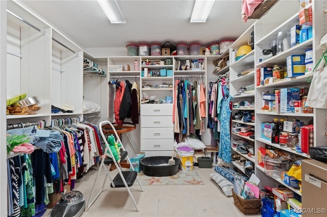 spacious closet featuring tile patterned flooring