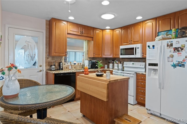 kitchen featuring light tile patterned floors, white appliances, a kitchen island, wooden counters, and tasteful backsplash