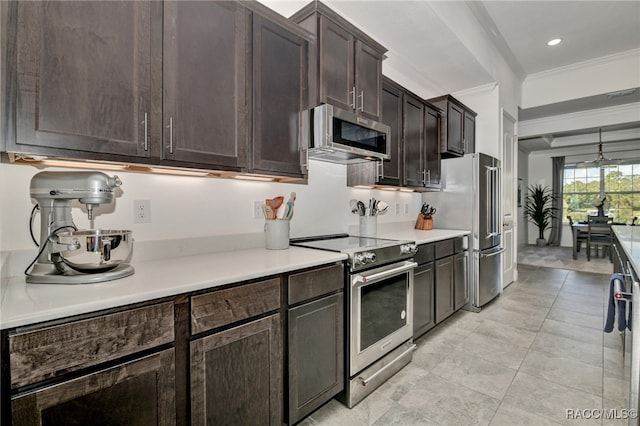 kitchen with dark brown cabinets, crown molding, light tile patterned floors, and stainless steel appliances