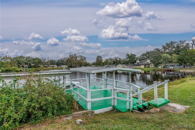 dock area featuring a yard and a water view