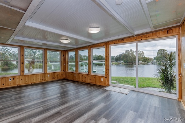 unfurnished sunroom featuring plenty of natural light and a water view