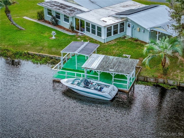 exterior space with a yard and a water view