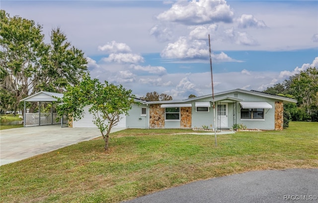 ranch-style home with a carport and a front lawn