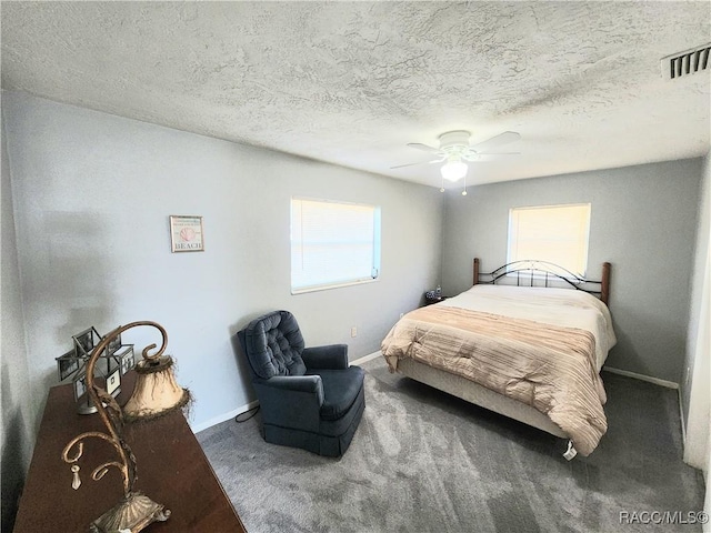 bedroom featuring visible vents, multiple windows, carpet, and baseboards