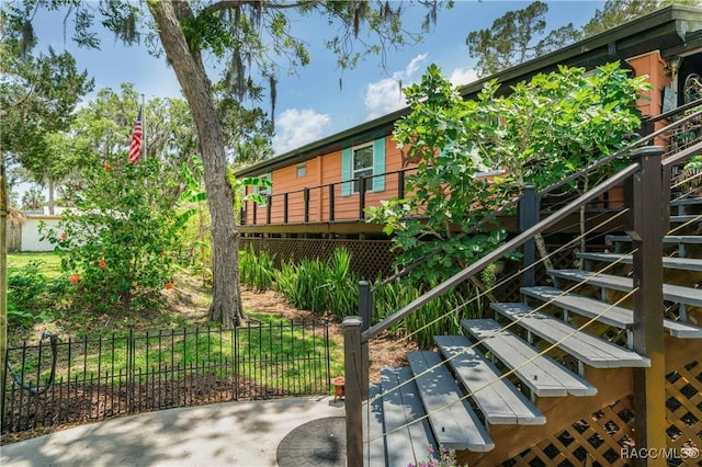 13465 W Hillbilly Ln, Crystal River, FL 34429 - view of home's exterior featuring stairs and a deck
