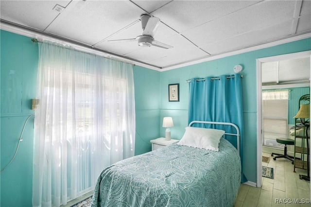 13465 W Hillbilly Ln, Crystal River, FL 34429 - bedroom featuring wood finished floors, a drop ceiling, and ceiling fan