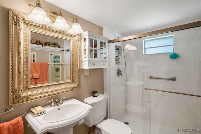 13465 W Hillbilly Ln, Crystal River, FL 34429 - bathroom with a shower stall, toilet, and a sink