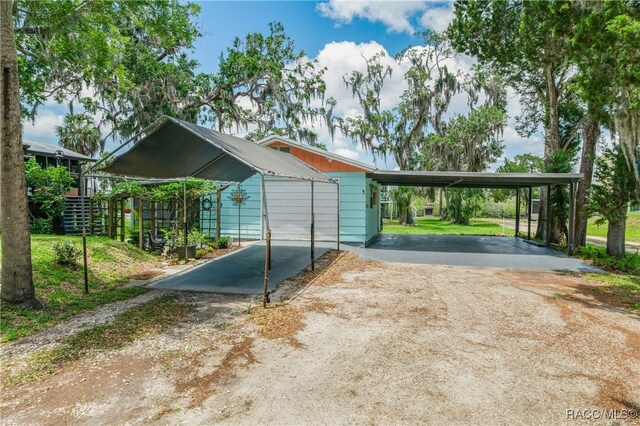13465 W Hillbilly Ln, Crystal River, FL 34429 - view of car parking with driveway