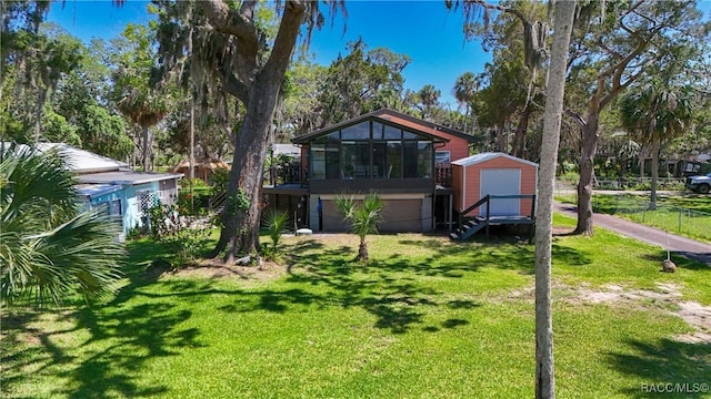 13465 W Hillbilly Ln, Crystal River, FL 34429 - view of front of property featuring a garage and a sunroom