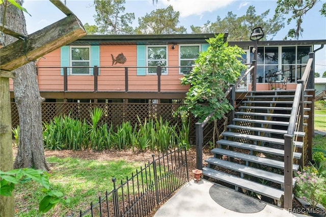 13465 W Hillbilly Ln, Crystal River, FL 34429 - rear view of property featuring stairs and a sunroom