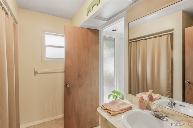 bathroom featuring tile patterned floors and vanity