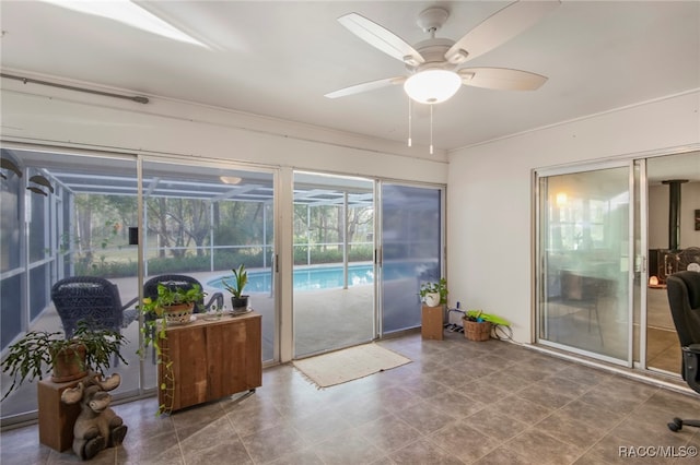 sunroom / solarium with ceiling fan