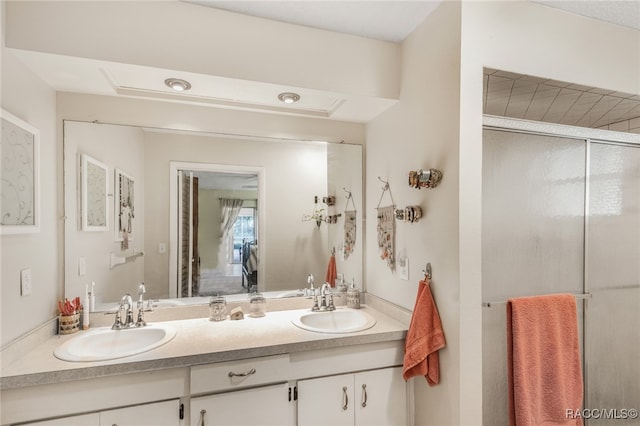 bathroom with vanity and walk in shower