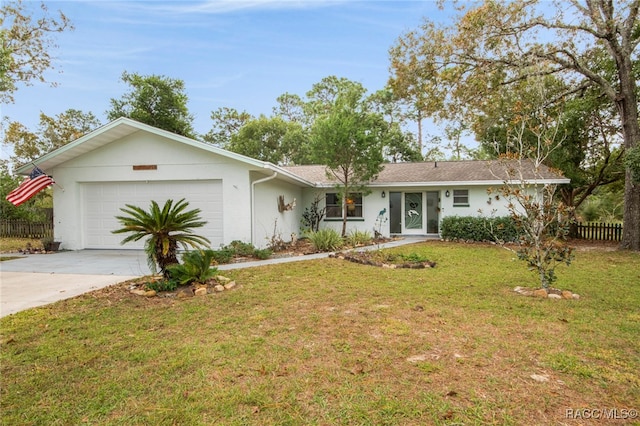 ranch-style house with a garage and a front yard