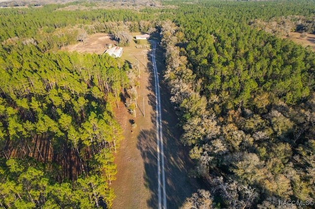 aerial view featuring a wooded view