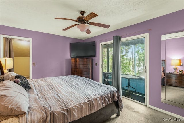 bedroom featuring baseboards, access to outside, carpet, and a ceiling fan