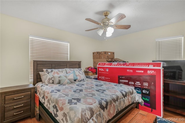 bedroom with ceiling fan and wood finished floors
