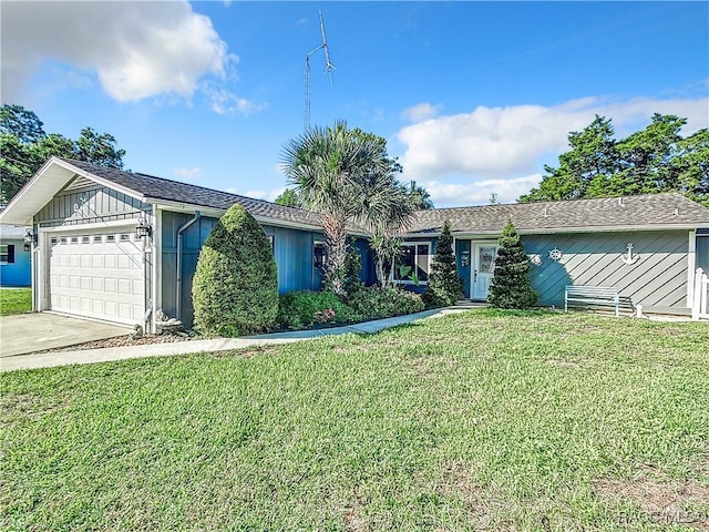 single story home with a garage and a front yard