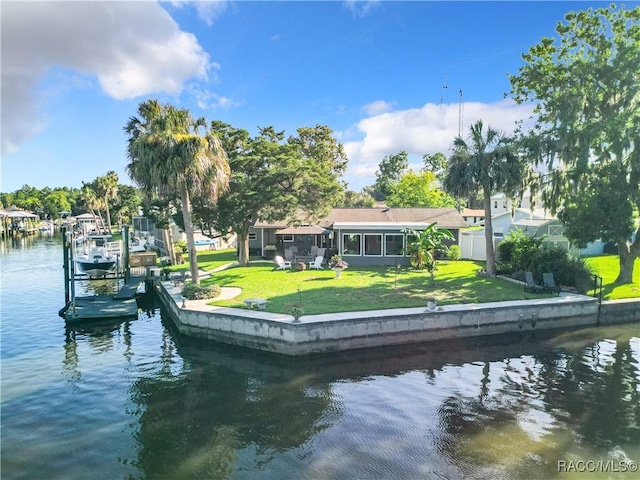 view of dock featuring a yard and a water view