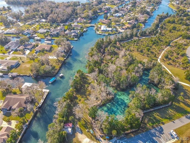 bird's eye view with a residential view and a water view