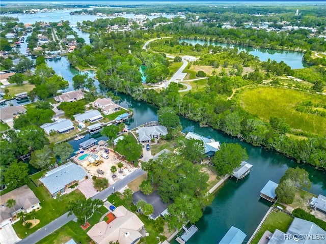 bird's eye view with a residential view and a water view