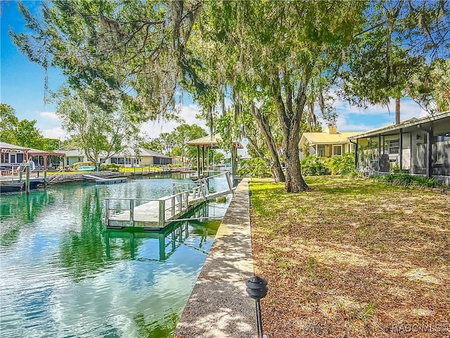 view of dock featuring a water view and a residential view