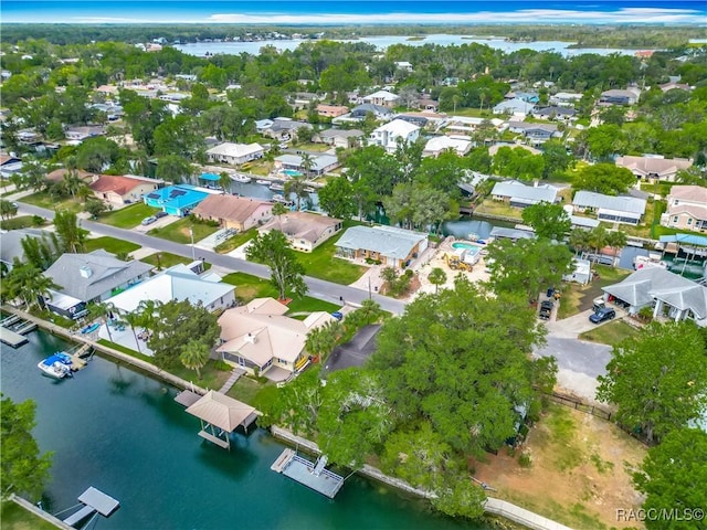 drone / aerial view featuring a water view and a residential view