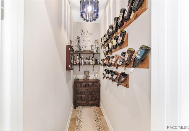 wine cellar featuring a chandelier