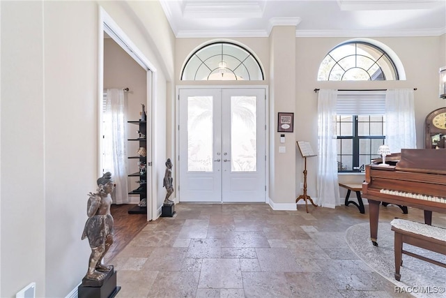 entryway with crown molding, french doors, and a high ceiling