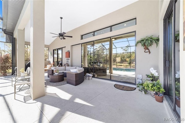 view of patio with a lanai, an outdoor hangout area, and ceiling fan