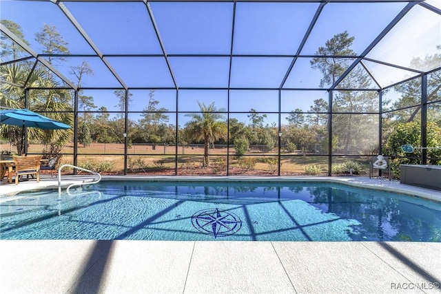 view of pool with a lanai and a patio