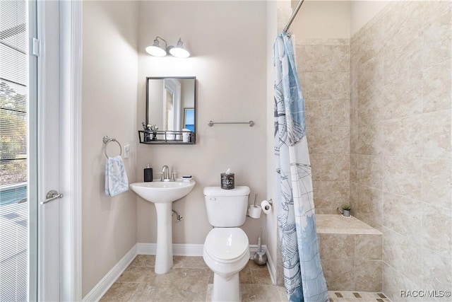 bathroom with toilet and walk in shower