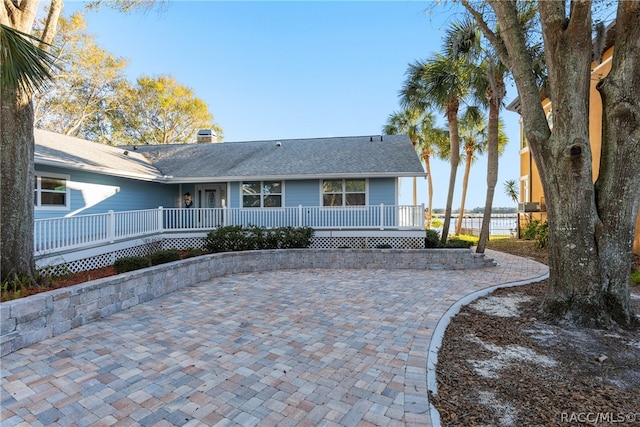 back of property with a patio