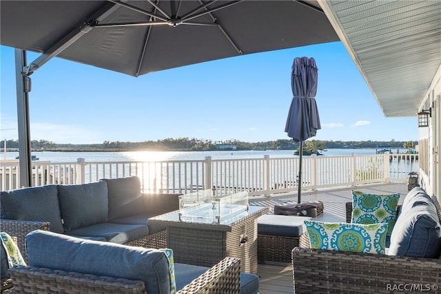 deck with a water view and an outdoor hangout area