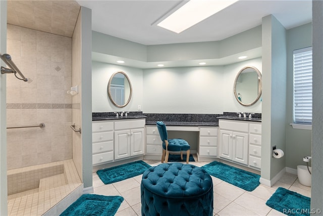 bathroom featuring tile patterned flooring and vanity