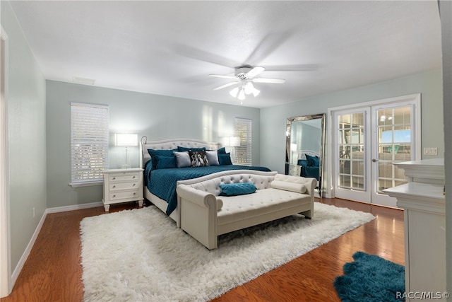 bedroom with ceiling fan, wood-type flooring, access to outside, and multiple windows