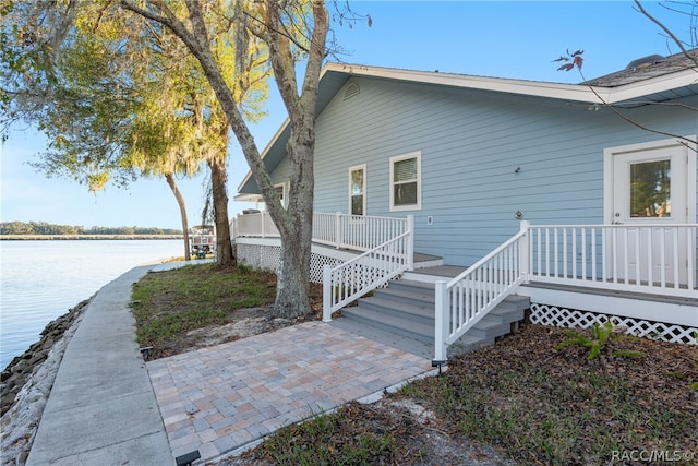 view of home's exterior featuring a water view