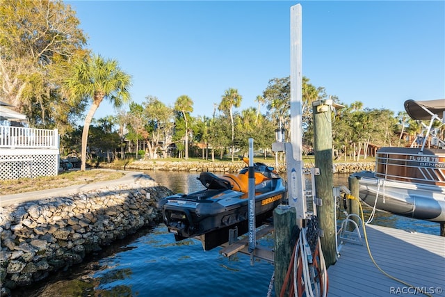 view of dock with a water view