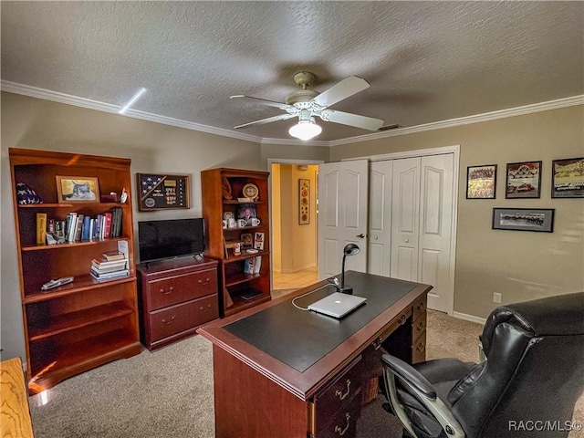 office space with crown molding, a textured ceiling, a ceiling fan, and light colored carpet