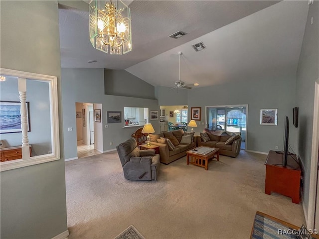 living area with high vaulted ceiling, visible vents, light carpet, and baseboards