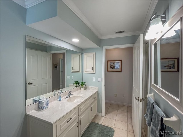 bathroom with visible vents, baseboards, vanity, ornamental molding, and tile patterned floors