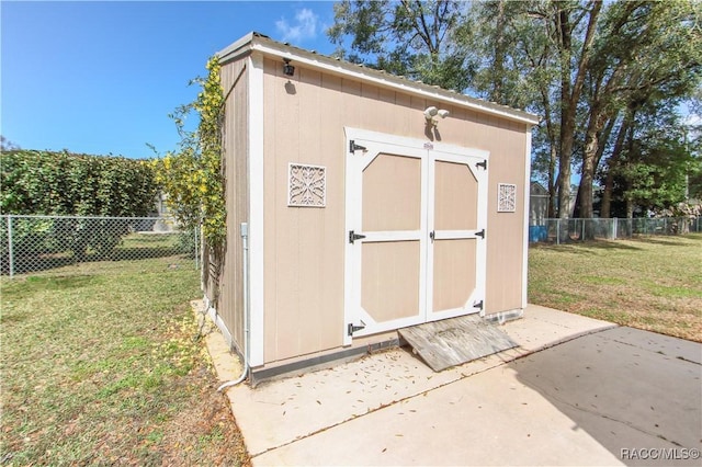 view of shed with a fenced backyard