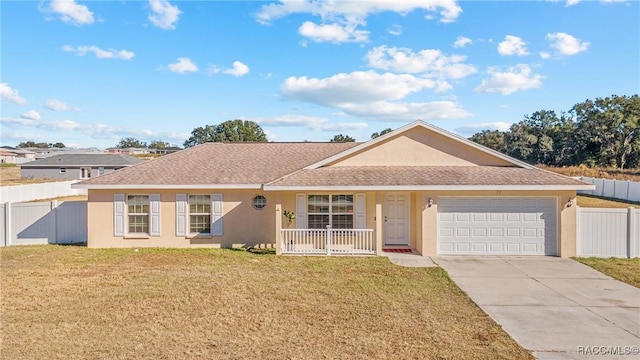 ranch-style home with a porch, a front yard, and a garage