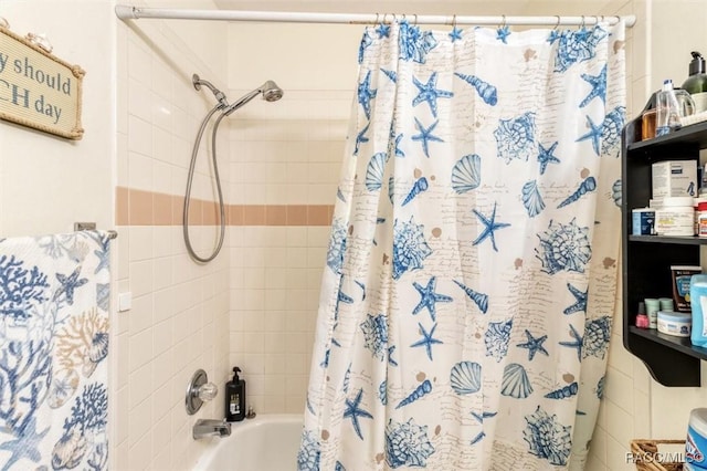 bathroom with shower / bath combo with shower curtain