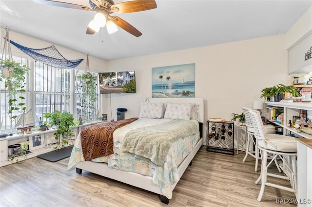 bedroom featuring ceiling fan and light hardwood / wood-style floors