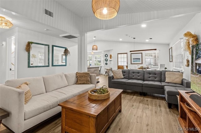 4080 N Eagle Nest Pt, Crystal River, FL 34428 - living area featuring wood finished floors, vaulted ceiling, and recessed lighting