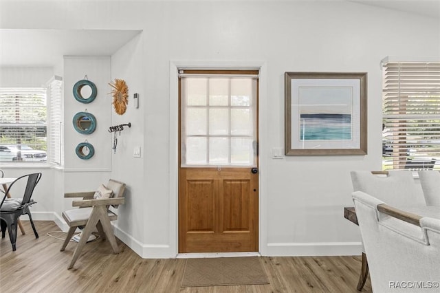 4080 N Eagle Nest Pt, Crystal River, FL 34428 - foyer entrance with light wood finished floors and baseboards