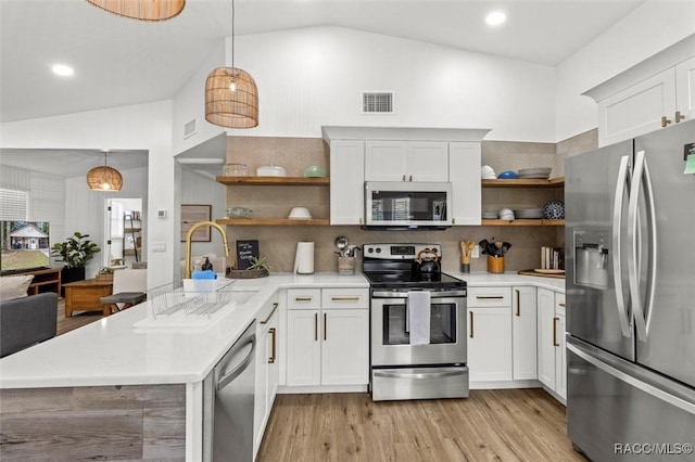 4080 N Eagle Nest Pt, Crystal River, FL 34428 - kitchen featuring stainless steel appliances, open shelves, light countertops, tasteful backsplash, and high vaulted ceiling