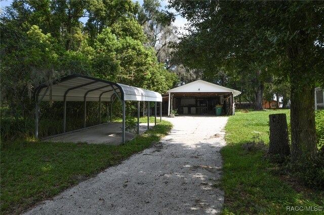 surrounding community featuring a garage and a yard