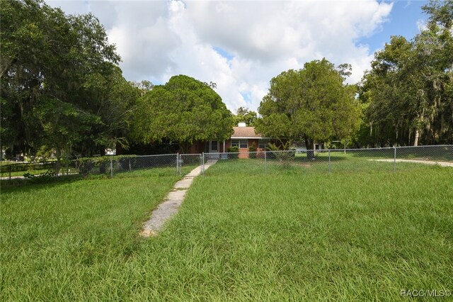 view of community featuring a yard